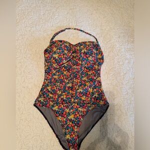 2 similar styled swimsuits. Size 14/16 but fit more like a 16L. Great length.